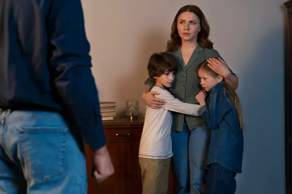 Mother Protecting Children