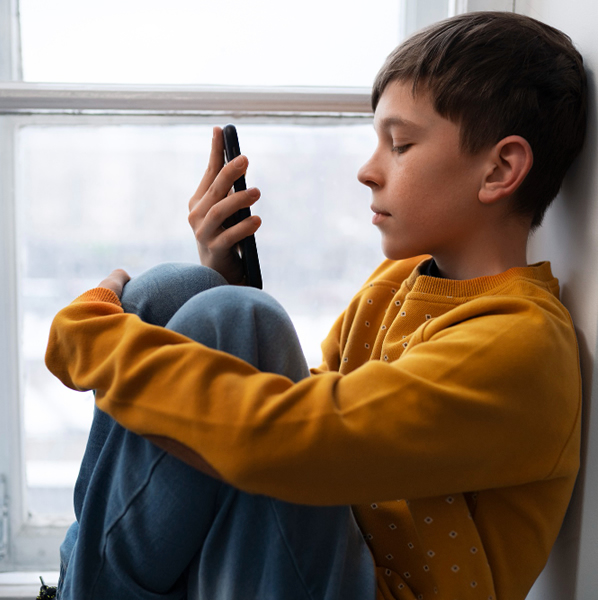 Lonely Boy on Phone
